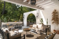 Partially covered outdoor living area on large terrace