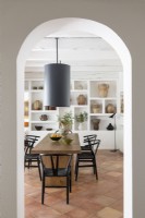 View to dining room through white archway
