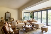 Neutrally decorated living room with large patio doors