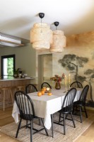 Vintage style dining room with mural feature wall