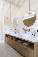 Double sinks with marble splashback