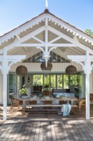 Covered outdoor living and dining area in summer 