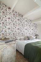 Country bedroom with floral feature wall