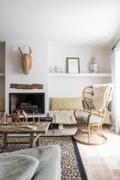 Vintage wicker armchair in simple country living room