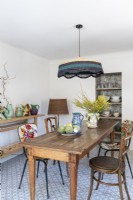 Vintage furniture and ceramics in country dining room