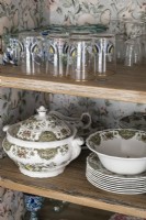 Detail of shelving with vintage crockery and glassware