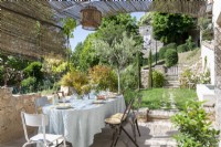 Covered outdoor dining area in country garden