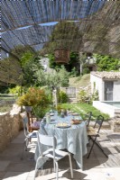 Shaded outdoor dining area of country house