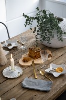 Detail of wooden dining table at Christmas