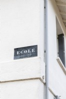 Ecole - Sign on exterior of converted school
