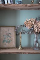 Dried flowers and framed vintage painting