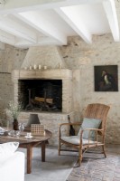 Country living room with stone walls and fireplace