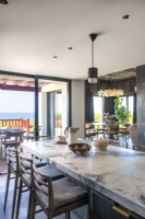 Breakfast bar - marble worktop on island of contemporary kitchen