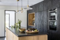 Modern kitchen with black cabinets and large island