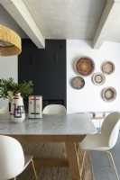 Modern dining room with display of ceramics and baskets