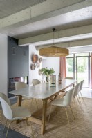 Modern dining room with open French windows in summer 
