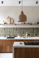 Modern wooden kitchen with stone tiled splashbacks