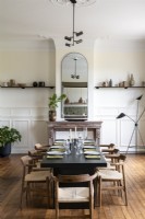 Modern dining room with wooden flooring and period details