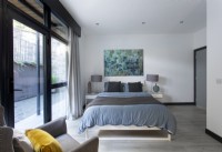 Contemporary bedroom with sliding patio doors 