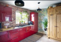 Red cabinets in colourful kitchen