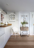 Chair and trolley in white and wooden country kitchen