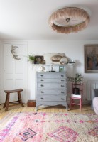 Grey painted chest of drawers in eclectic living room