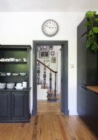 Modern black and white kitchen with view to hallway 