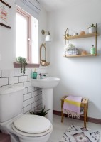 Modern white bathroom with pastel accessories 