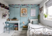 Blue painted panelled wall in childrens room