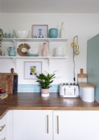 Wooden worktop in white and blue kitchen