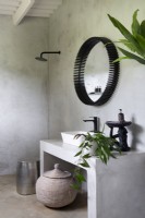 Minimalist bathroom with concrete vanity, floor and walls