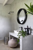 Minimalist bathroom with concrete vanity, floor and walls