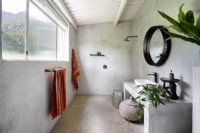 Minimalist bathroom with screed floor and walls