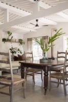 Rustic chairs and vintage table in dining area