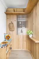 Storage solution with slatted wall.