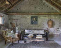 Bare stone walls in rustic living room