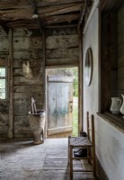 Open wooden door of rustic home