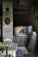 Crates and sacks in rustic barn storage area