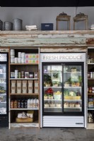 Detail of shop shelving and fridge for fresh produce