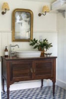 Wooden unit with sink in classic style bathroom