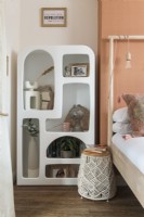 Unusual moulded shelf unit in modern bedroom