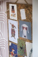 Detail of noticeboard with animal postcards pinned to it