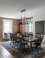 Exposed brickwork wall in modern country dining room