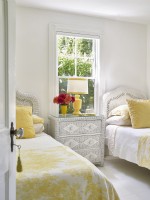 Yellow and white twin bedroom