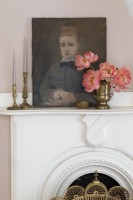 Classic portrait painting on white mantelpiece