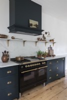 Large range cooker in modern country kitchen 