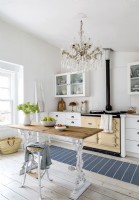 Chandelier and vintage furniture in country kitchen