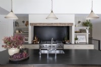 Pendant lights over island in modern country kitchen