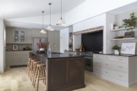 Large central island in modern country kitchen