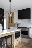 Contemporary black, white and wooden kitchen-diner